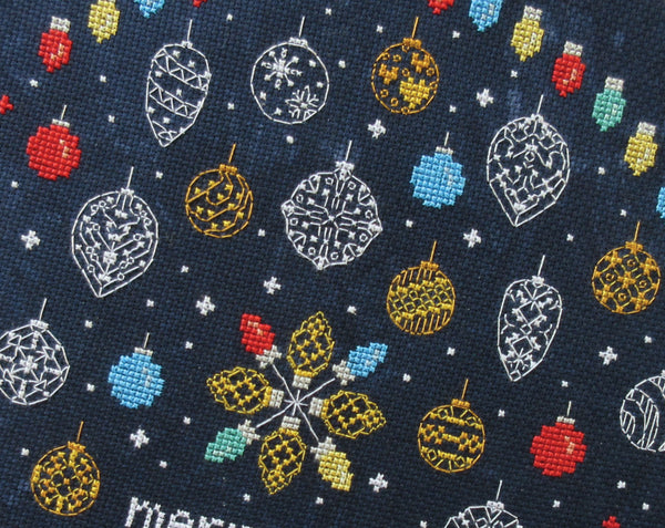 Baubles and Fairy Lights cross stitch pattern. Close up of upper part of stitched piece.