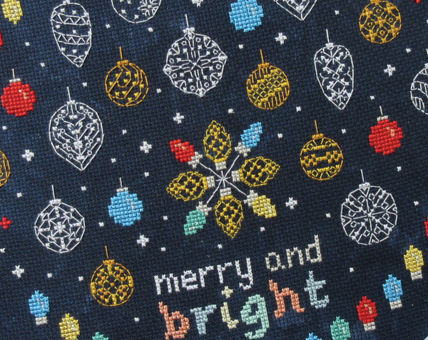 Baubles and Fairy Lights cross stitch pattern. Close up of lower part of stitched piece.