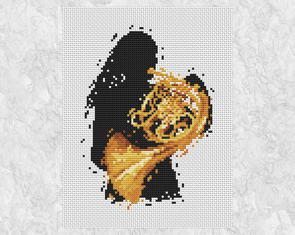 Female French Horn player cross stitch pattern. Shown without frame.