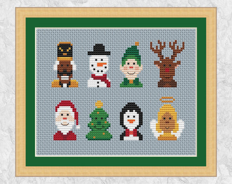 Mini Christmas Characters cross stitch pattern. Eight cute characters - Nutcracker, Snowman, Elf, Reindeer, Santa, Tree, Penguin and Angel. Shown with frame.