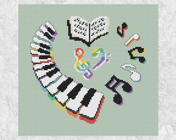 Piano Heart cross stitch pattern. Heart shape formed fromo a keyboard, music notes, music book and treble and bass clefs. Shown without frame.