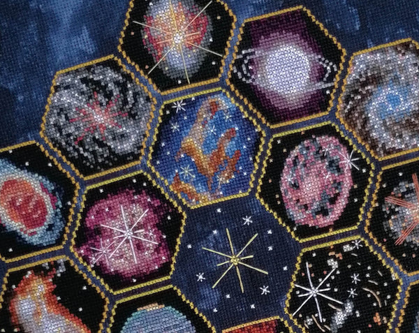 Wonders of the James Webb Space Telescope cross stitch pattern. Close up of upper part of whole piece.